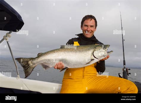 Fisherman with catch Stock Photo - Alamy