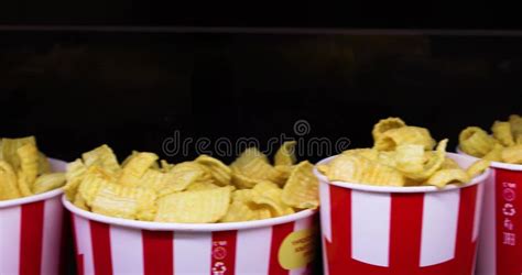 Packaging with Chips and Different Flavors of Popcorn for Watching a Movie Close-up. Family ...