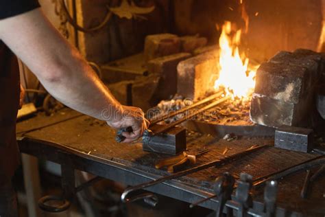 Blacksmith Manually Forging on Iron on Anvil at Forge. Treatment of Molten Metal Close-up Stock ...