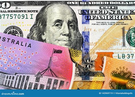 An Australian One Dollar Bill with a an American One Hundred Dollar ...