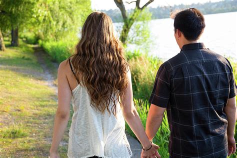 Couple Walking While Holding Hands Photograph by Joshua Rainey | Fine ...