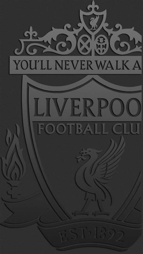 the liverpool football club logo is shown in black and white, as well as an ornate crest