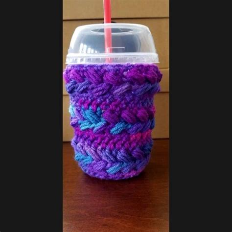 a purple and blue cup with a straw in it