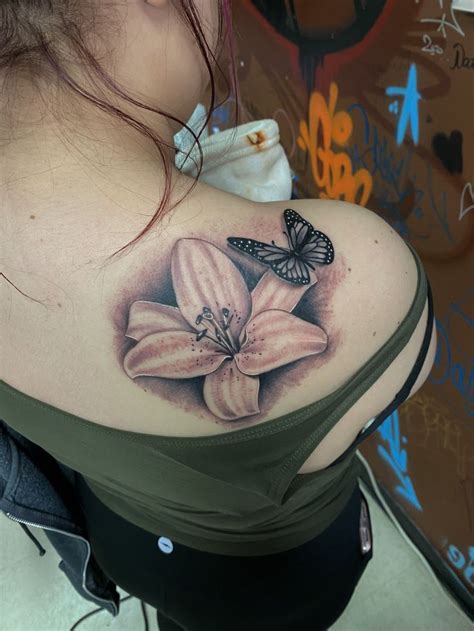 Lily with Black and Gray Butterfly in 2020 | Skin color tattoos, Color tattoo, Lily tattoo