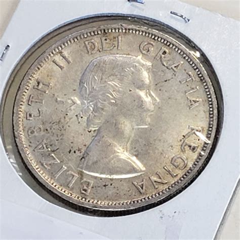 1958 CANADIAN SILVER DOLLAR - Big Valley Auction