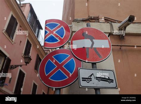 Rome, Italy: quirky street art by French street artist, Clet, on a no entry road sign in ...