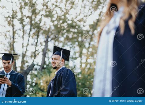 A Diverse Group of University Students in Graduation Gowns Celebrating Their Achievement ...