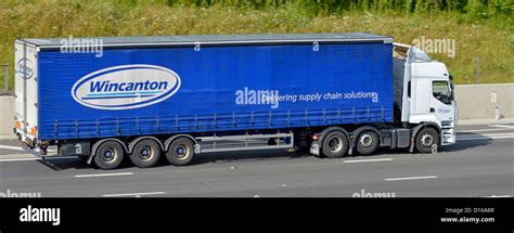 Wincanton logo & supply chain solutions slogan on side view of semi hgv ...