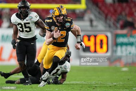 Missouri Tigers quarterback Brady Cook runs on a keeper play during ...