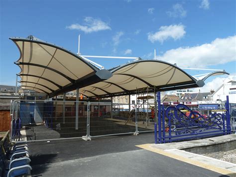 Tensile canopy - NEWQUAY - Fabric Architecture - metal frame / with glass fiber cone / for ...