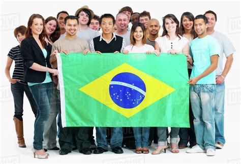 Group of people holding flag - Stock Photo - Dissolve