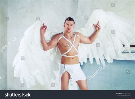 Male Model Big White Angel Wings Stock Photo (Edit Now) 1077890579