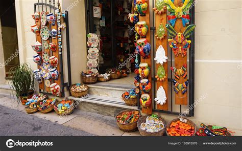 LECCE, ITALY - AUGUST 2, 2017: crafts souvenir store in old cozy street in Lecce, Italy ...