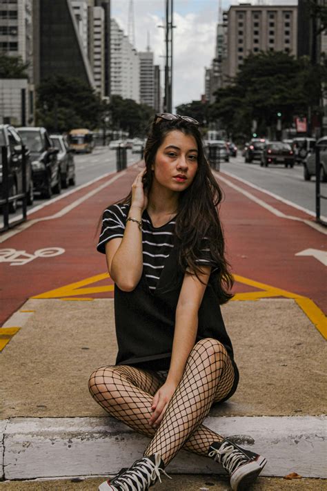 Woman Sitting In The Middle Of The Road · Free Stock Photo