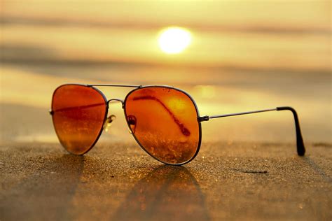 red, lens sunglasses, sand, sea, sunset, selective, focus photography ...