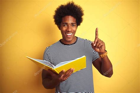 Afro American Student Man Reading Book Standing Isolated Yellow Background Book Stands ...