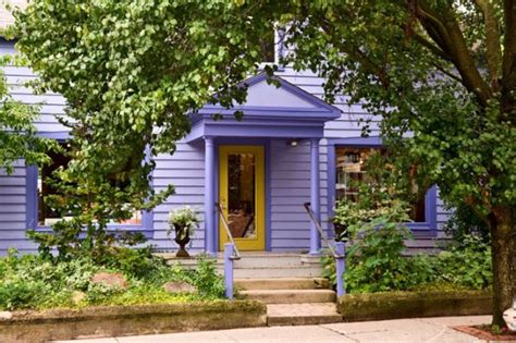 Purple + yellow. I like that they used a darker purple for the trim. It … | Exterior house paint ...