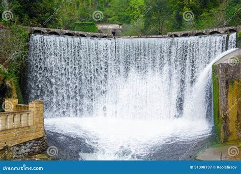 Dam waterfall in New Athos stock image. Image of light - 51098737