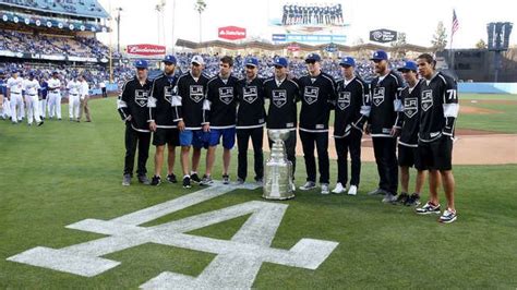 Members of the Stanley Cup champion Los Angeles Kings pose with the Cup ...