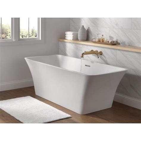 Immerse yourself in a deeply relaxing soak with the Delta Torrelle Freestanding Bathtub. Designe ...