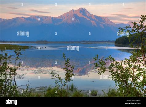 Sunrise on Pioneer Peak with Jim Lake in the foreground, Southcentral ...