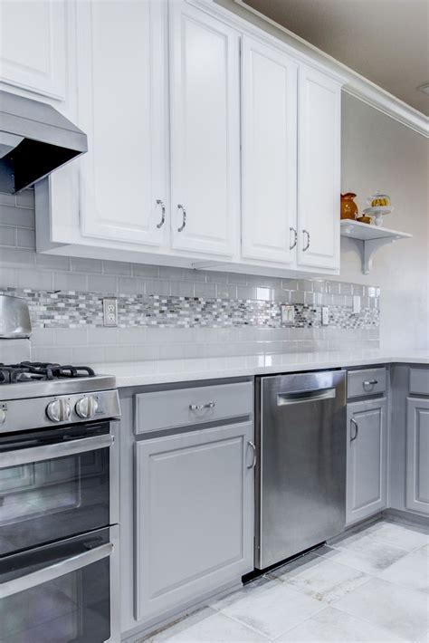 We brought this kitchen up to date by painting the existing cabinets white on top and a… | White ...