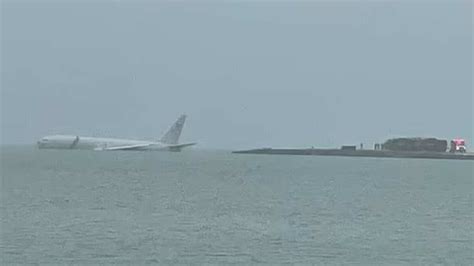 Watch: Huge US Navy aircraft overshoots runway, ends up floating in ...