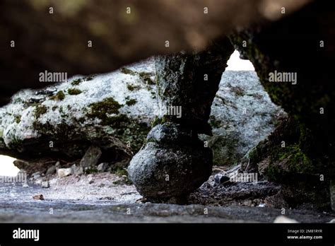 A peculiar round rock formation on the underside of a large boulder Stock Photo - Alamy