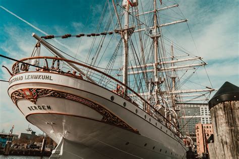 Modern white sailboat moored in harbor · Free Stock Photo