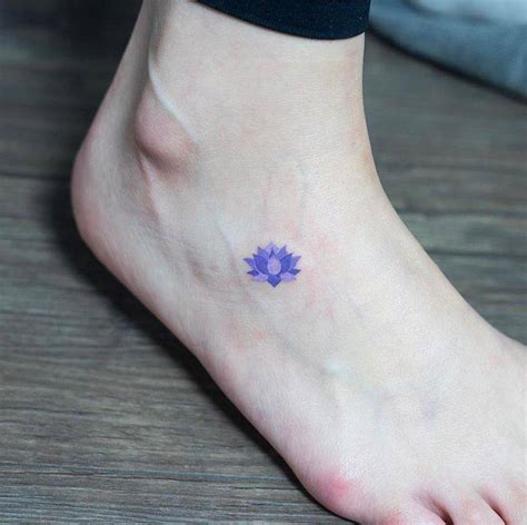 Blue lotus flower tattoo on the foot - Tattoogrid.net