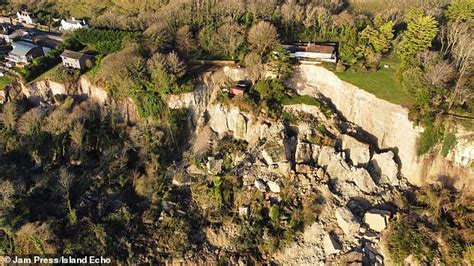 Huge landslide on Isle of Wight sees around 20 homes evacuated just two weeks before Christmas ...