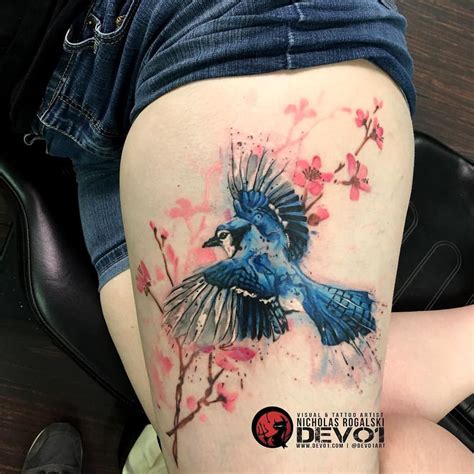 Just finished the second session of a water color tattoo. It's a blue jay bird flying over a ...