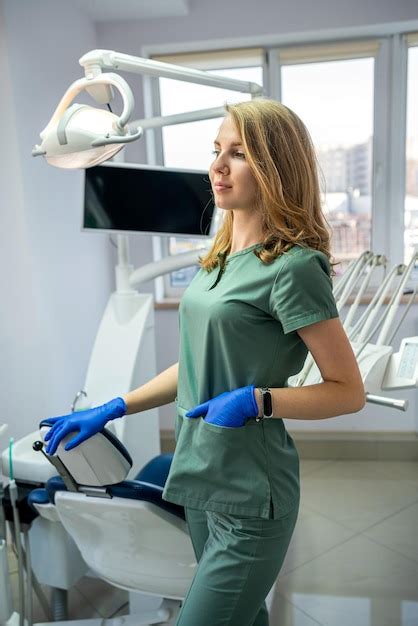 Premium Photo | Portrait of pretty female dentist at dental clinic