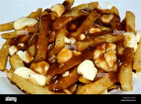 Poutine - french fries brown gravy cheese curds from Quebec Stock Photo ...