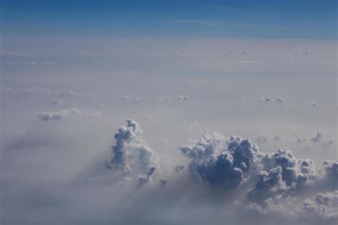 clouds and blue sky seen from plane 9566553 Stock Photo at Vecteezy