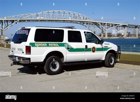 US Border Patrol SUV sitting near shore of St. Clair River, Blue Stock ...