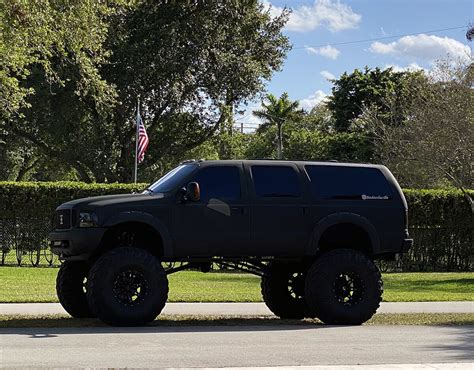 Lifted 2004 Ford Excursion Monster Truck On 49” Super Swampers - offroadium.com