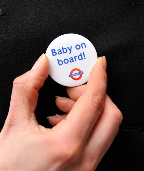 'Baby on board' Kate given badge as she joins The Queen on trip to ...