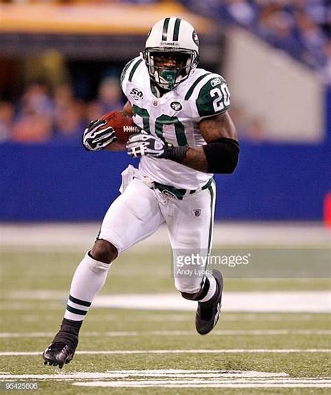 Thomas Jones of the New York Jets runs with the ball during the NFL game against the ...