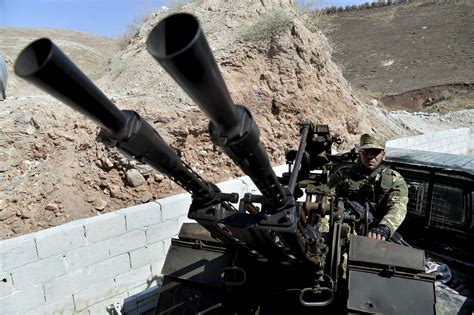 Turkey says Syrian rebels withdraw heavy weapons in Idlib | AP News