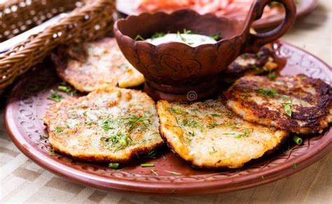 Belarusian Draniki with Sour Cream and Herbs in a Restaurant Stock ...