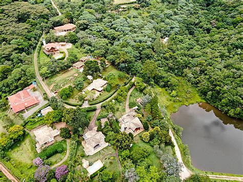 An Overview Of A Tropical Valley Containing A Lake Forest And Villa Seen From Above Photo ...