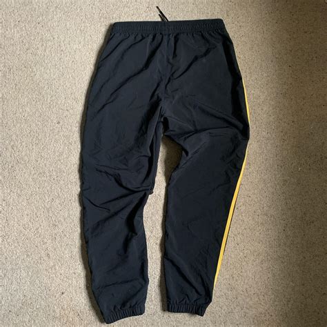 Adidas originals nylon track pants Black/yellow... - Depop