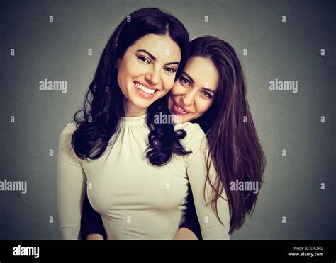 Beautiful girlfriends two best friends embrace hug each other Stock ...