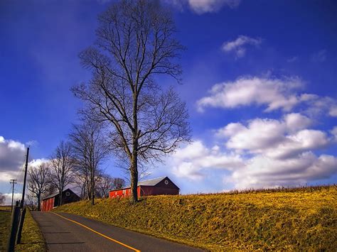 HD wallpaper: empty road between green grass under white and blue cloudy sky | Wallpaper Flare