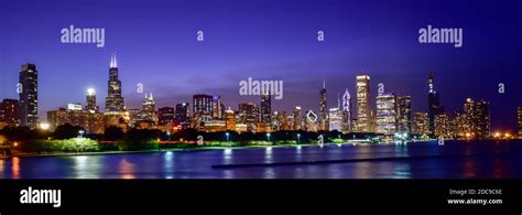 Big city skyline lights and skyscrapers along the waterfront Stock Photo - Alamy