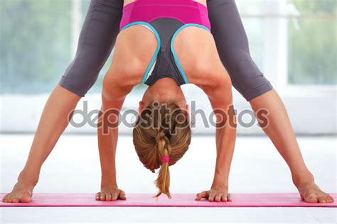 Young beautiful woman doing yoga. - Whitman Wellness Center