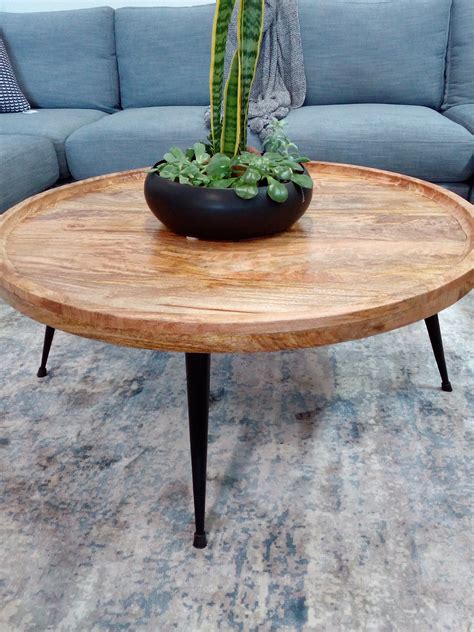 Wesley Mango Wood Round Coffee Table | Bay Furniture