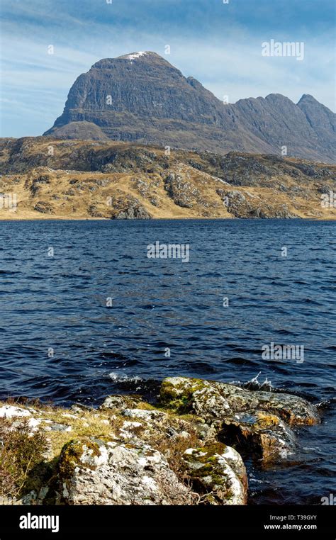 LOCHINVER SUTHERLAND SCOTLAND SUILVEN WITH SNOW ON THE DOME OF CAISTEAL ...