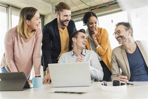 Happy business people having a meeting in office stock photo